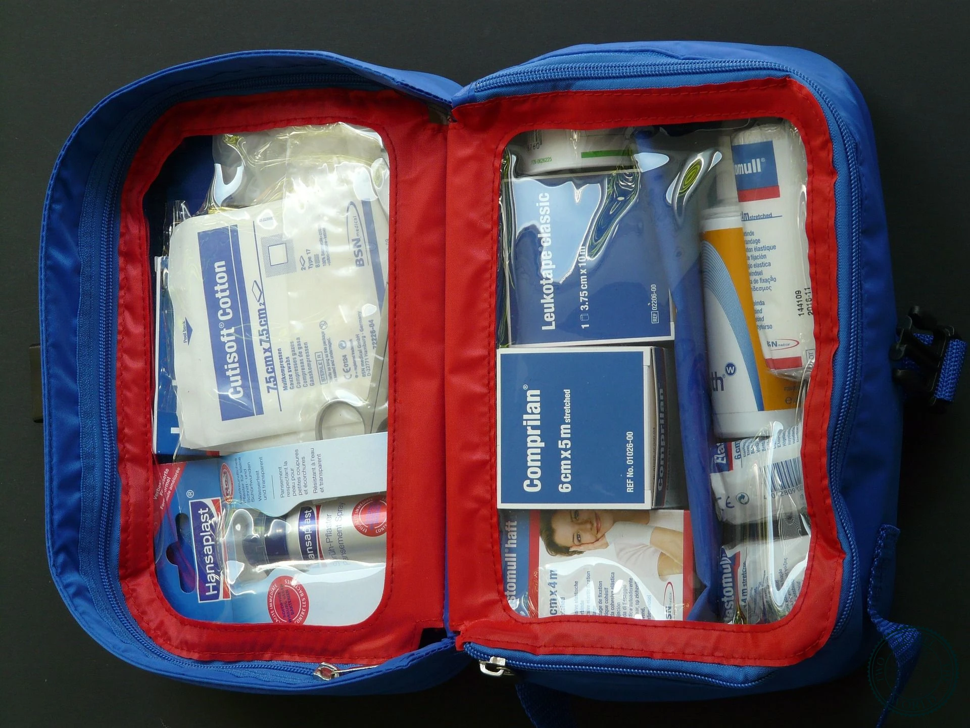 Travel first aid equipment including insect repellent, sunblock, and hygiene supplies