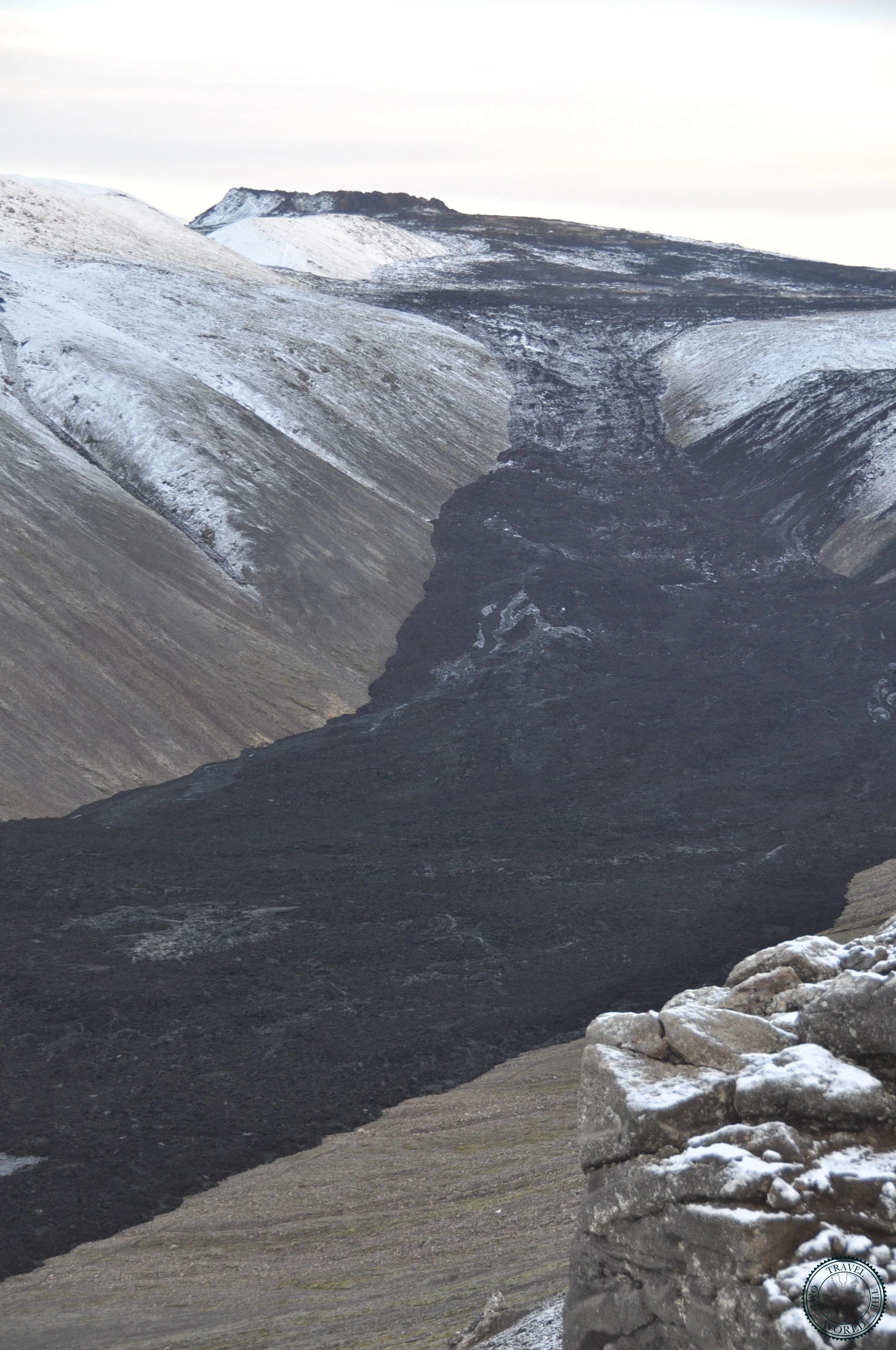 Colour palette of black lava, rust red oxidation, and sulphur yellow deposits