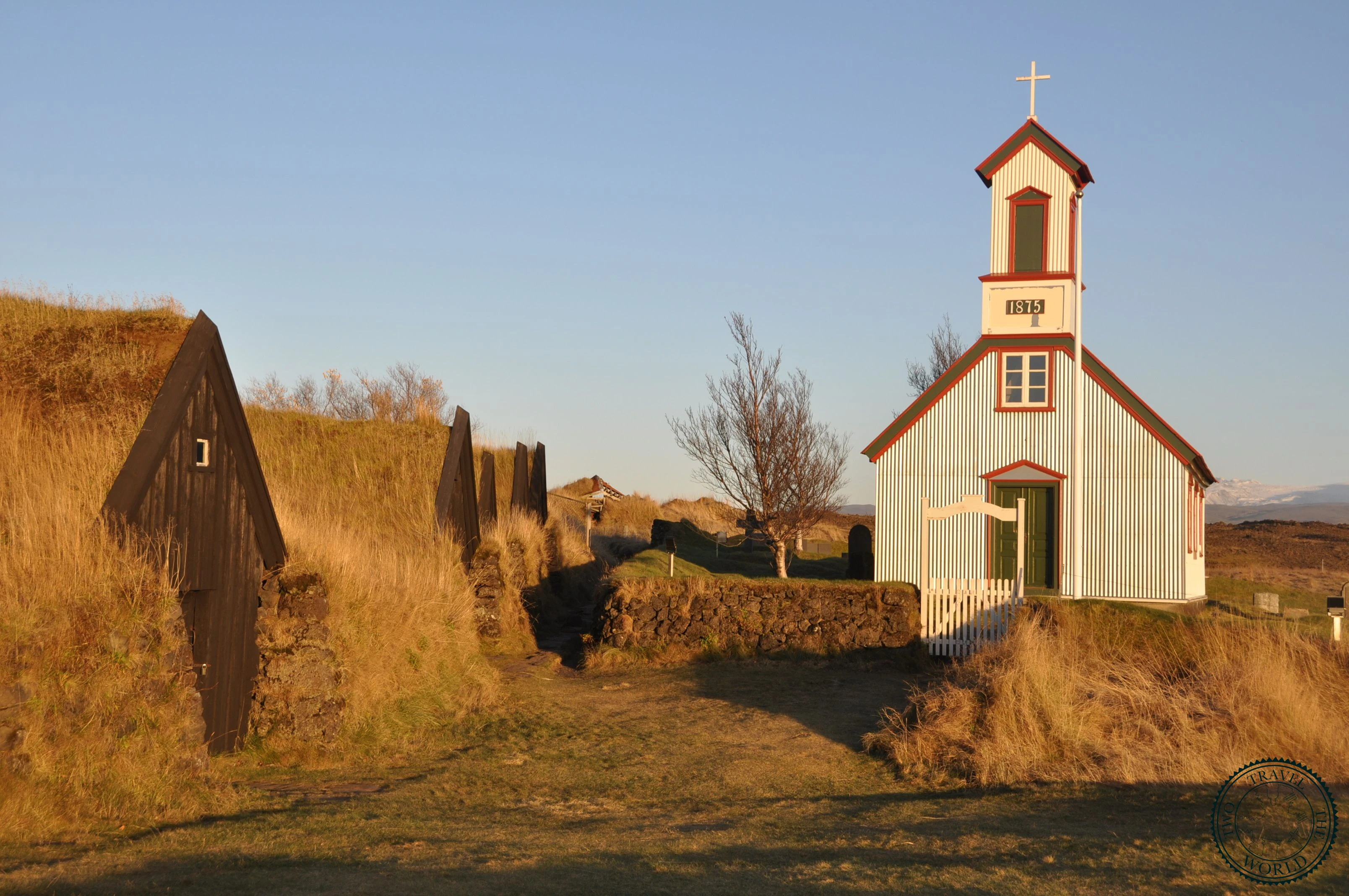 The grass-roofed turf houses of Keldur blending into the surrounding meadow