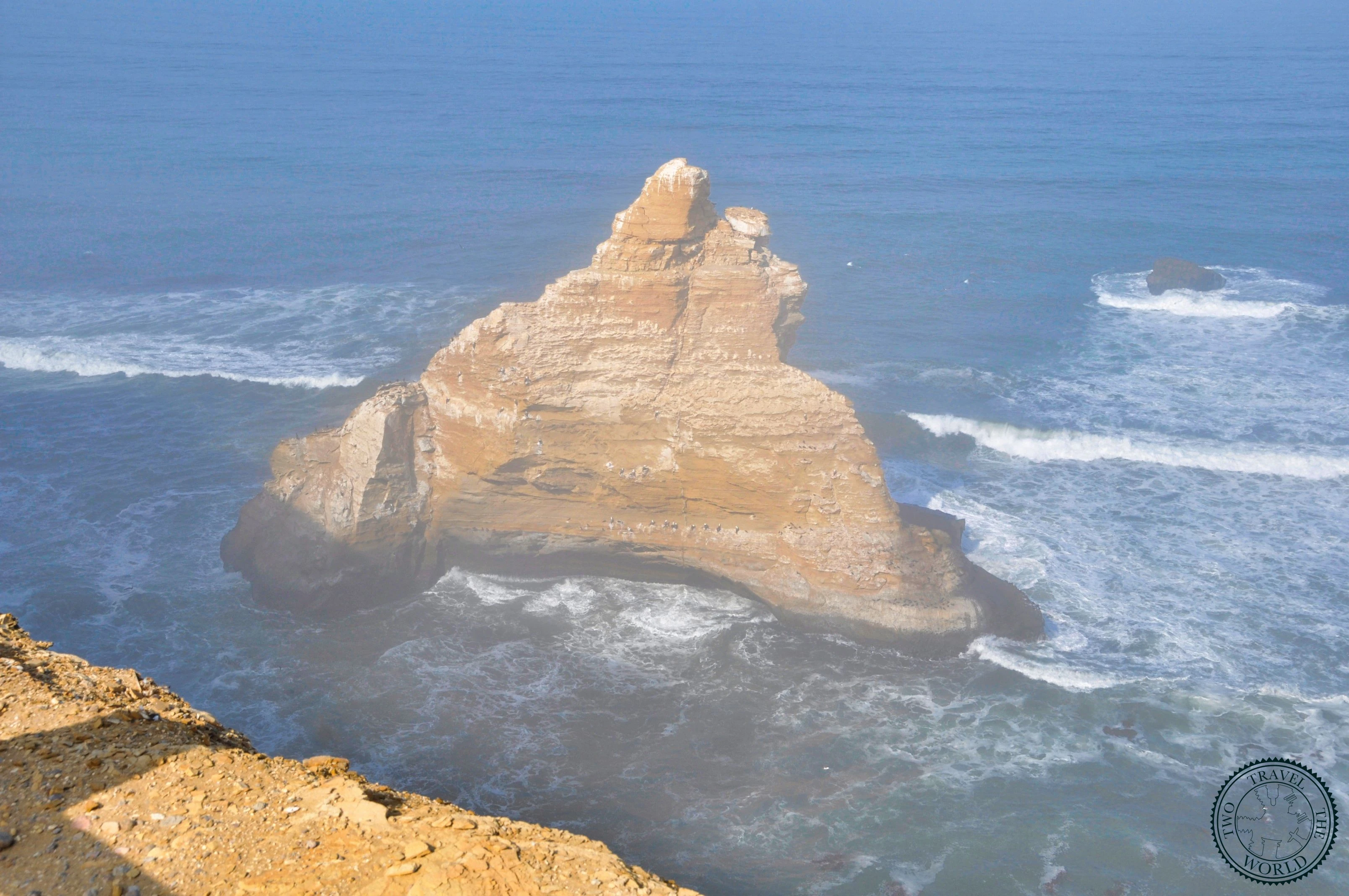Rugged desert landscape with rocky terrain and barren mountains in Paracas National Reserve