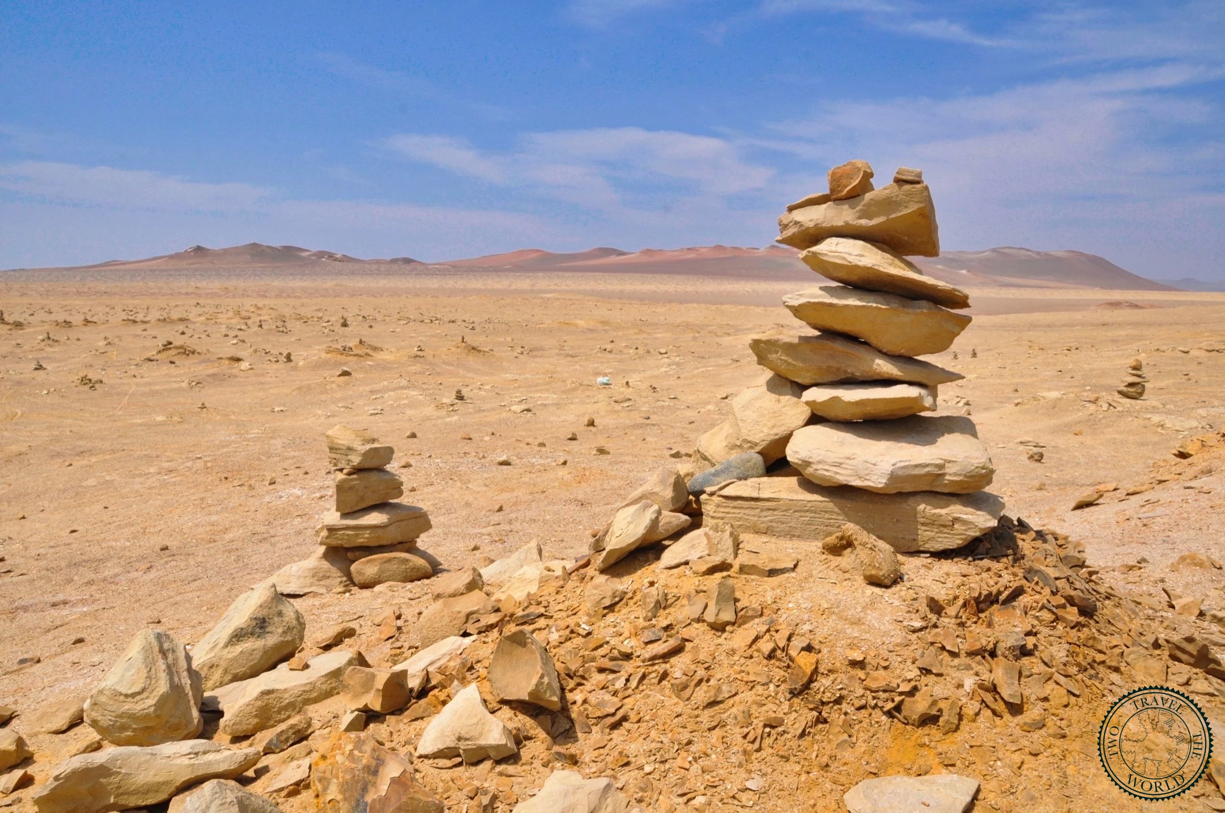 Dramatic cliffs overlooking the Pacific Ocean with Andes Mountains visible in the distance
