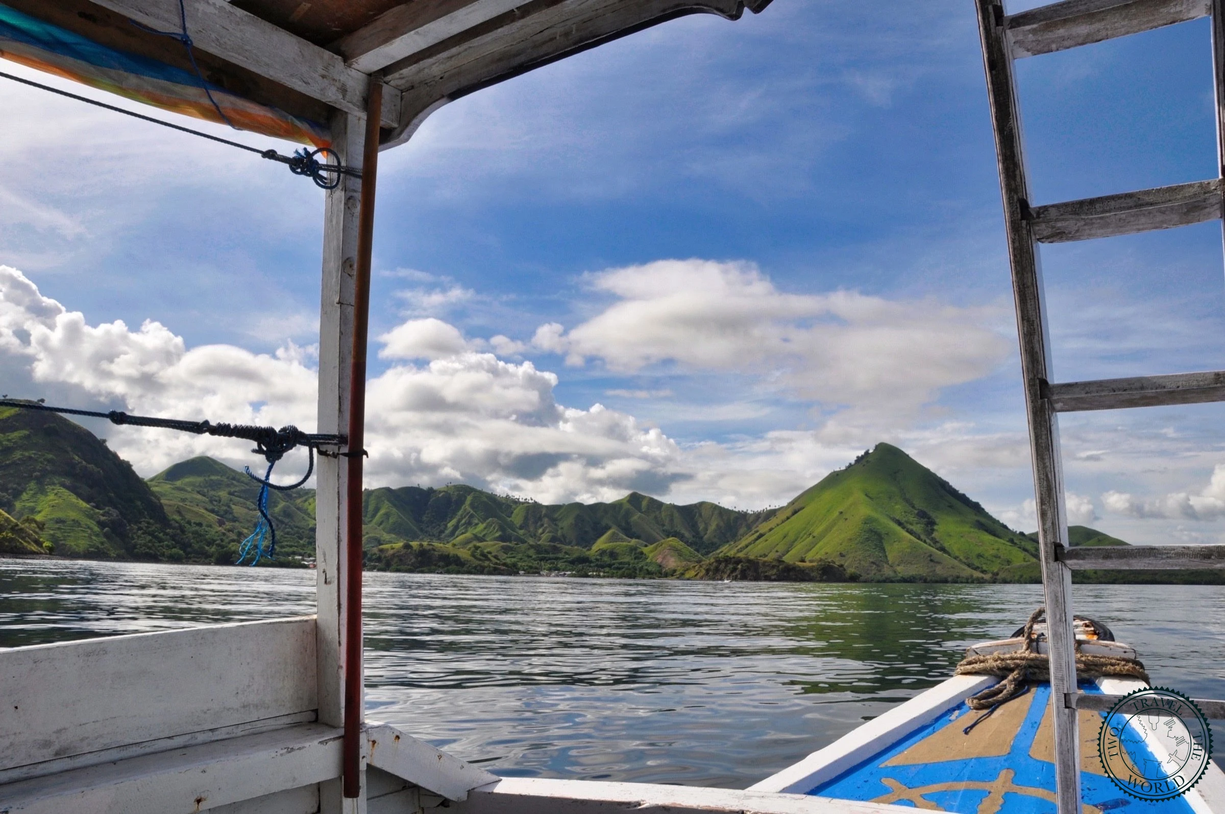 Traditional wooden longboat used for budget Komodo tours departing from Labuan Bajo