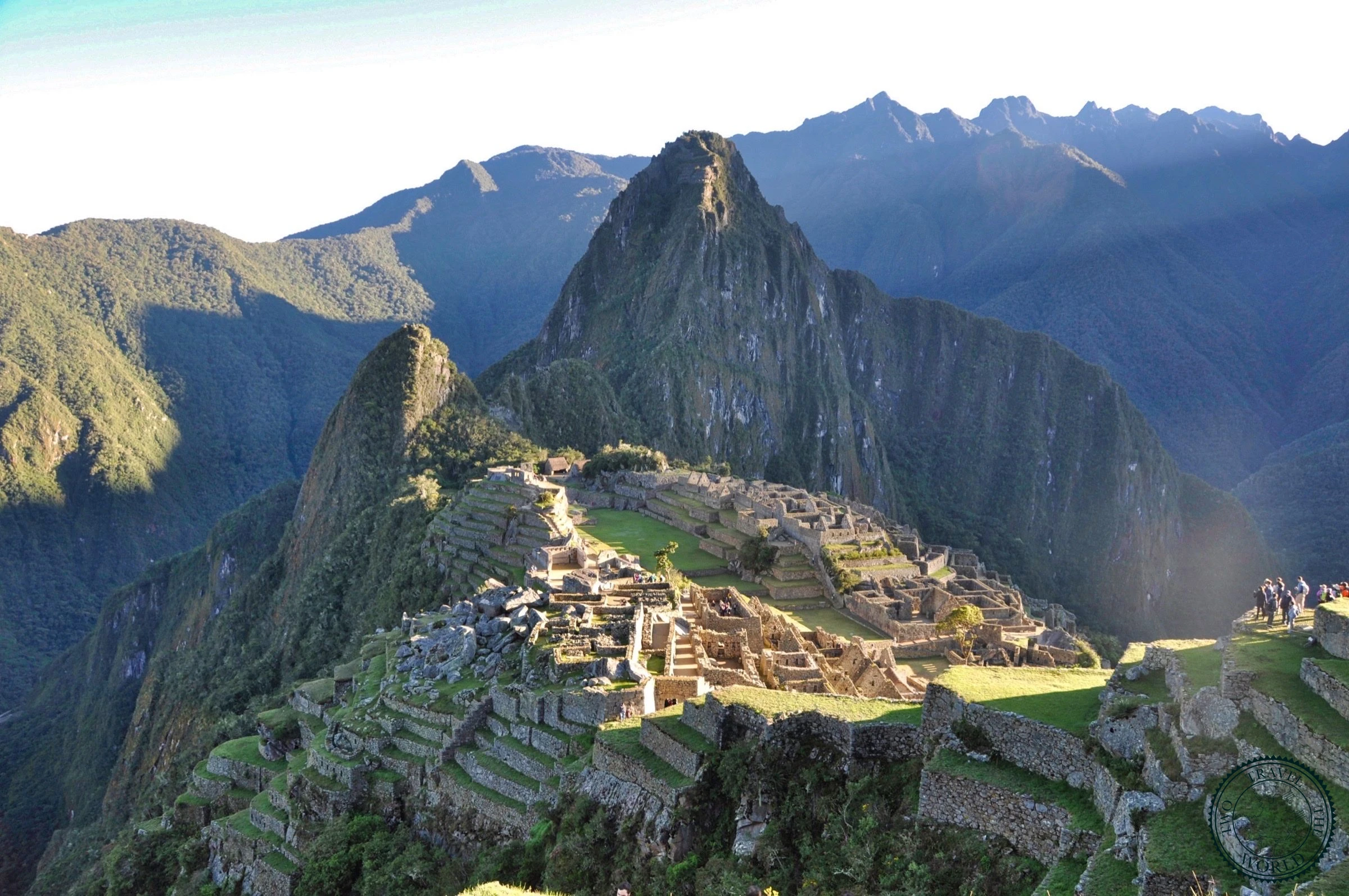 Machu Picchu ruins with dramatic mountain backdrop and morning mist