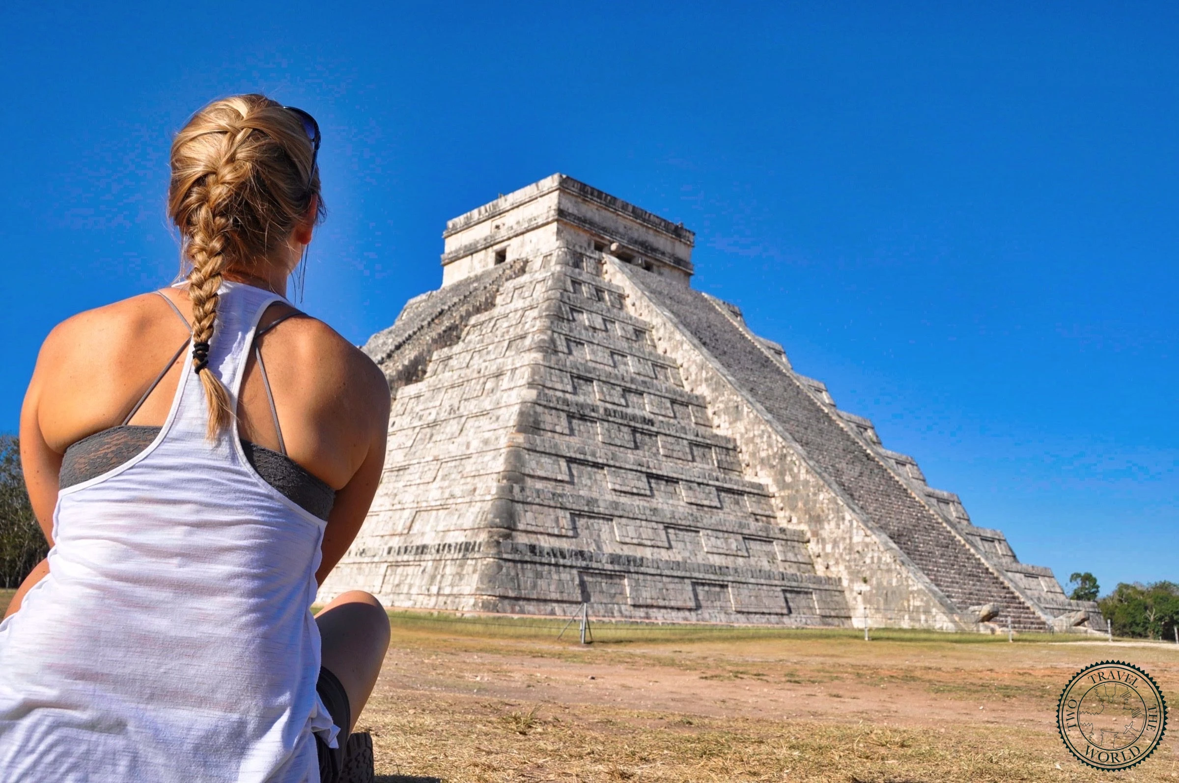Side view of El Castillo pyramid showing the detailed stone steps and architectural precision of Maya construction