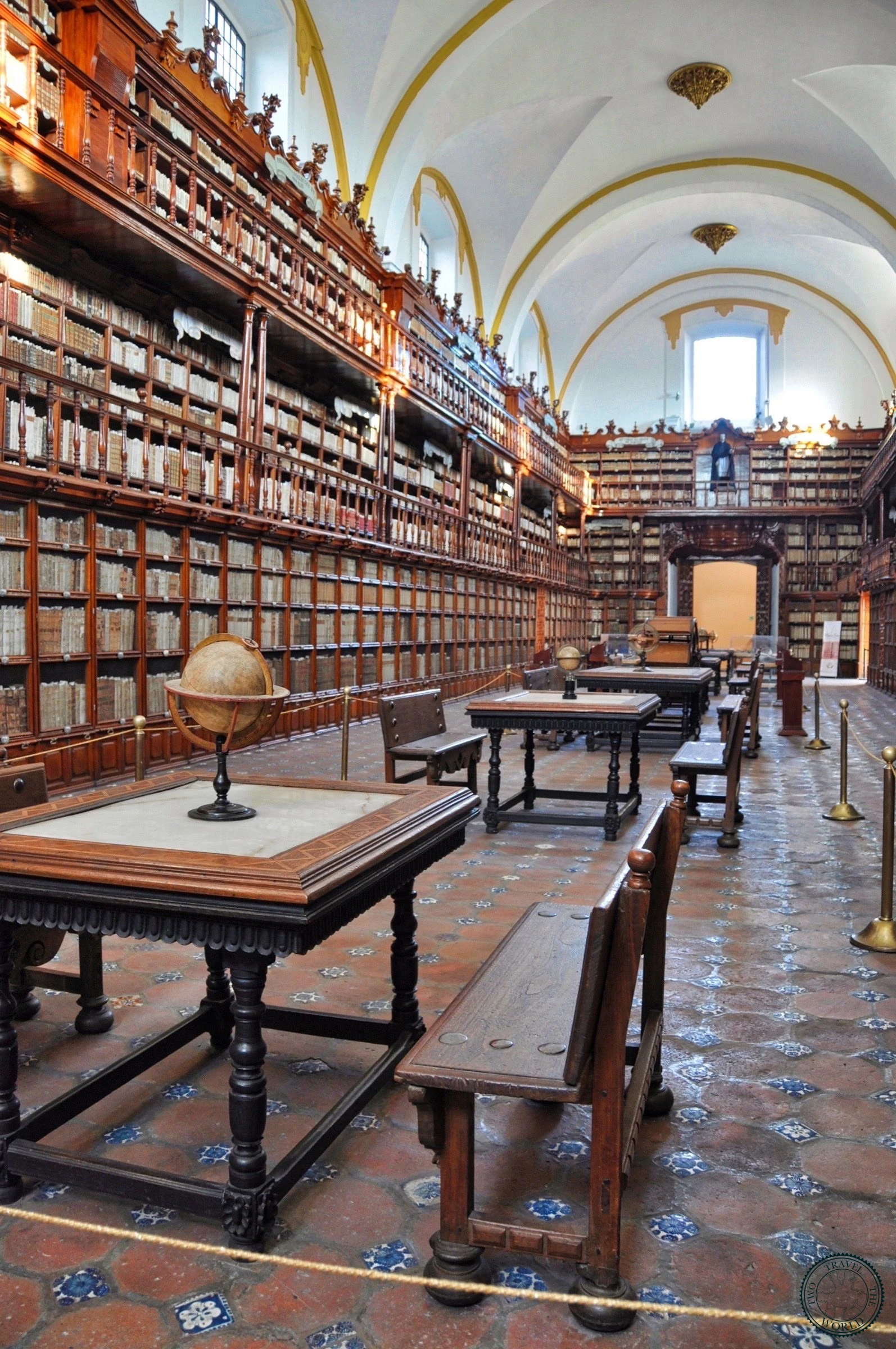 The stunning Biblioteca Palafoxiana with its floor-to-ceiling wooden bookshelves filled with ancient volumes, the oldest library in the Americas