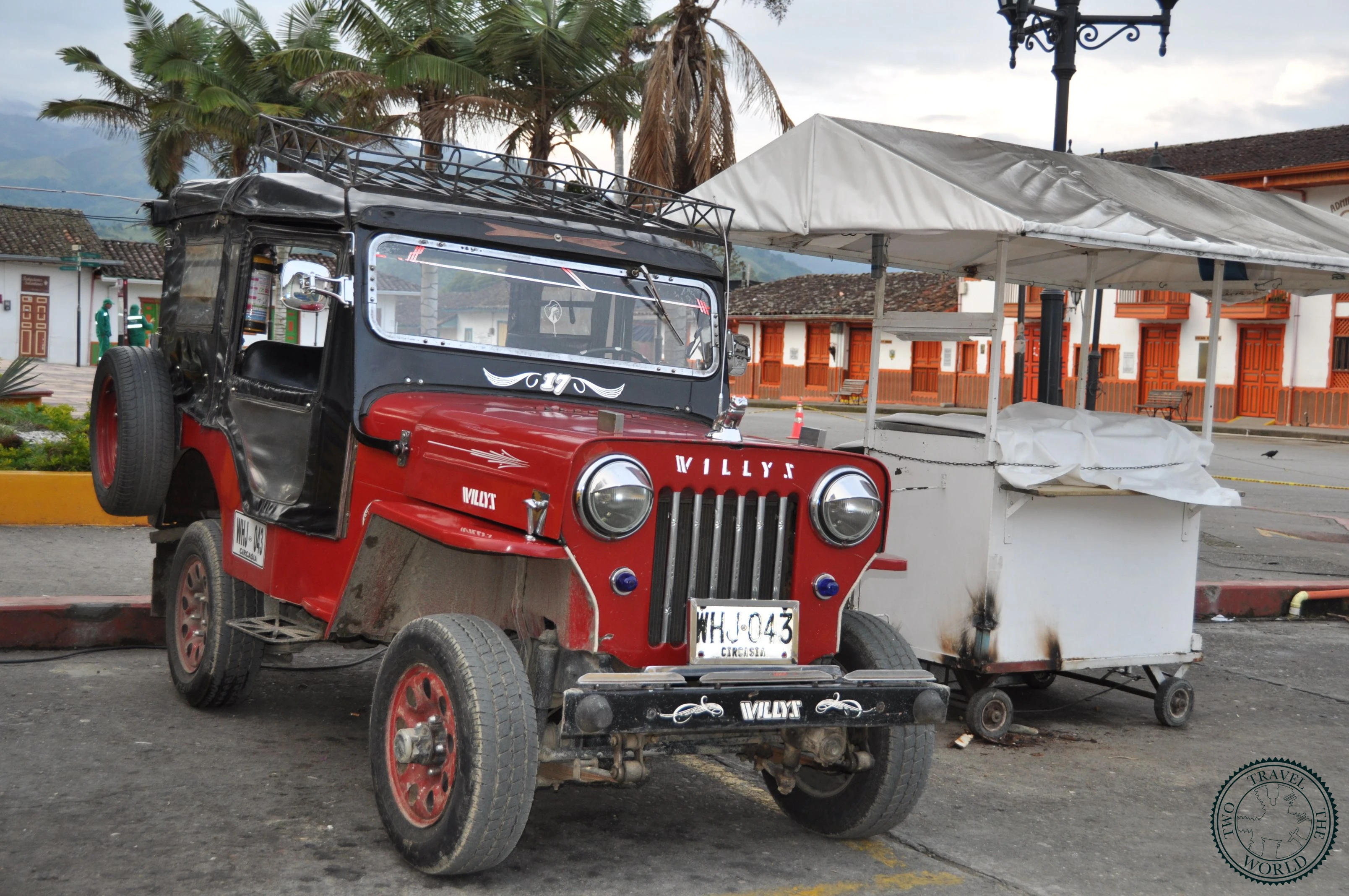 Traditional Willy jeep packed with tourists driving through Colombian countryside to Valle de Cocora