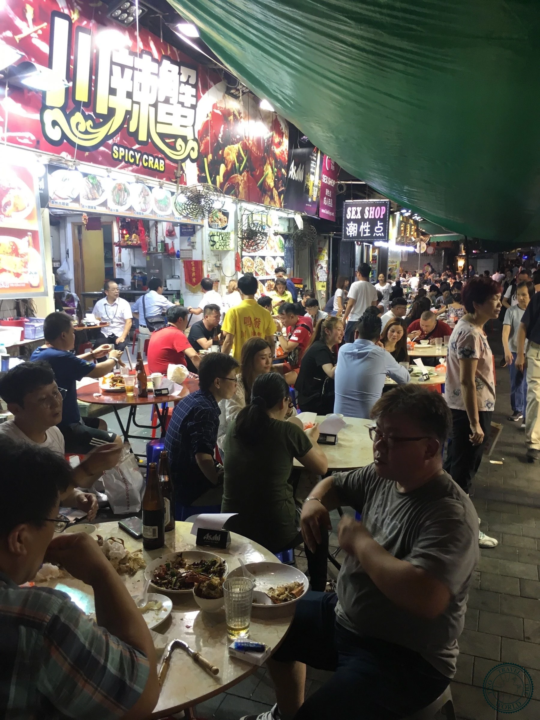 Street food stalls at Temple Street Market offering fresh seafood and local dishes