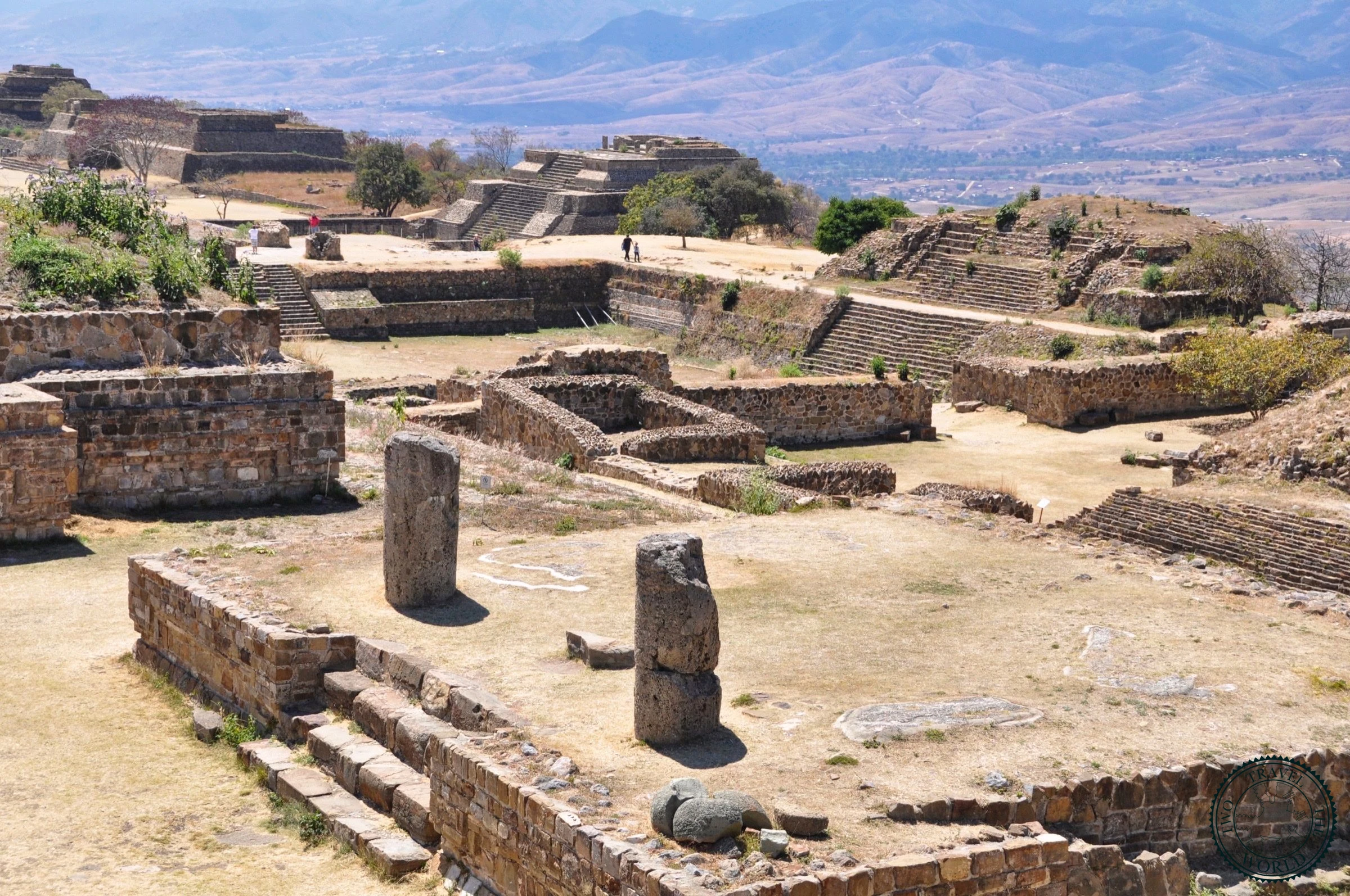 View from the top of Monte Albán pyramid showing the expansive archaeological complex and surrounding mountains