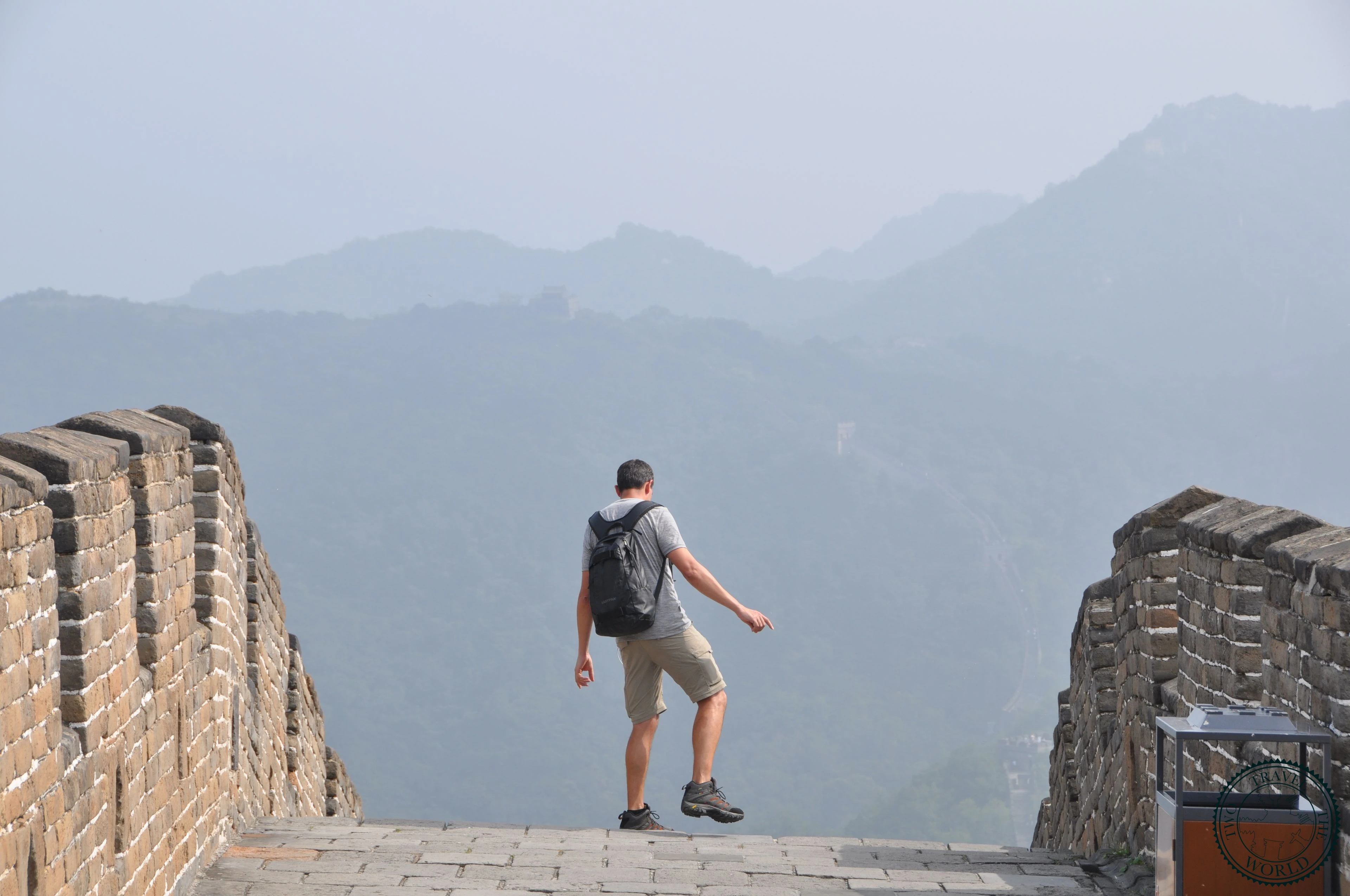 Ancient watchtower on the Great Wall with misty mountains in the background
